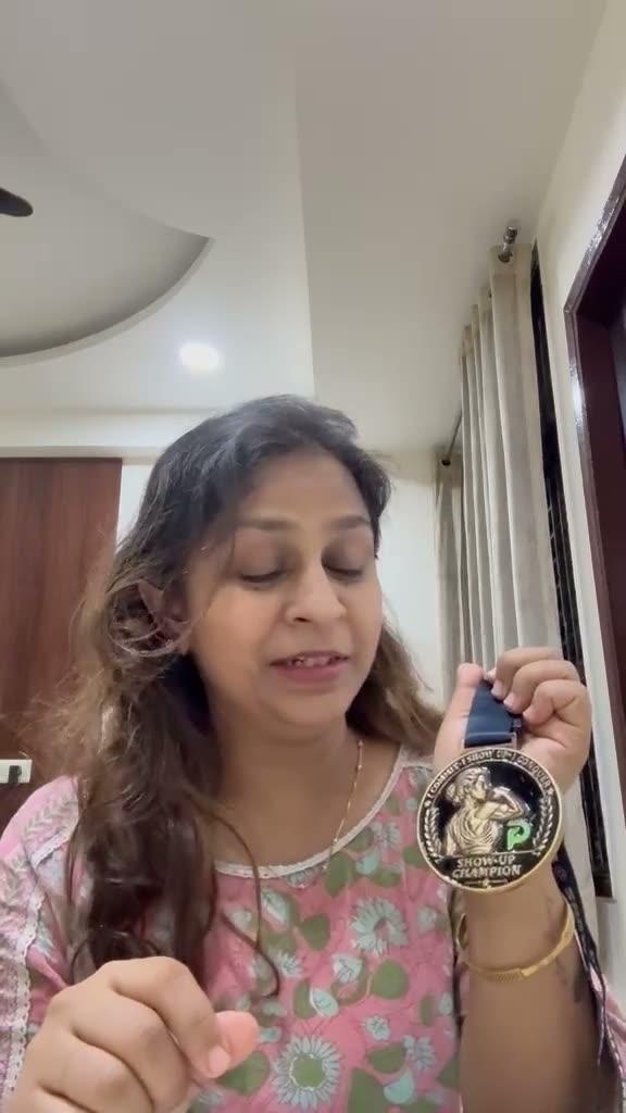 Meetu with her Show-Up Champion medal